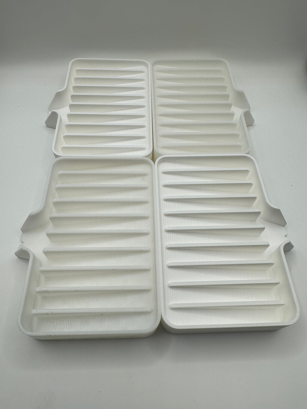 white soap tray with drainn