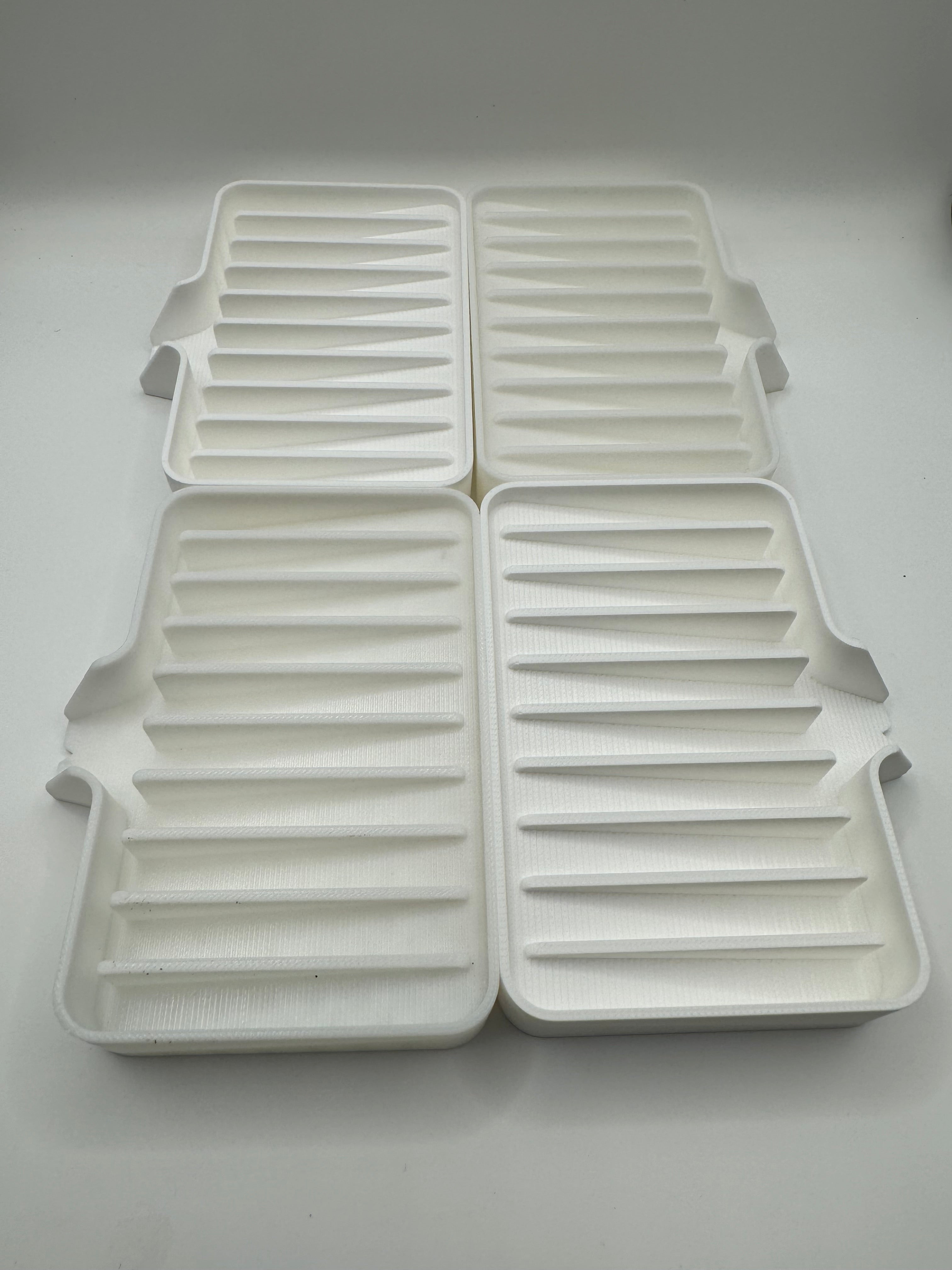 white soap tray with drainn