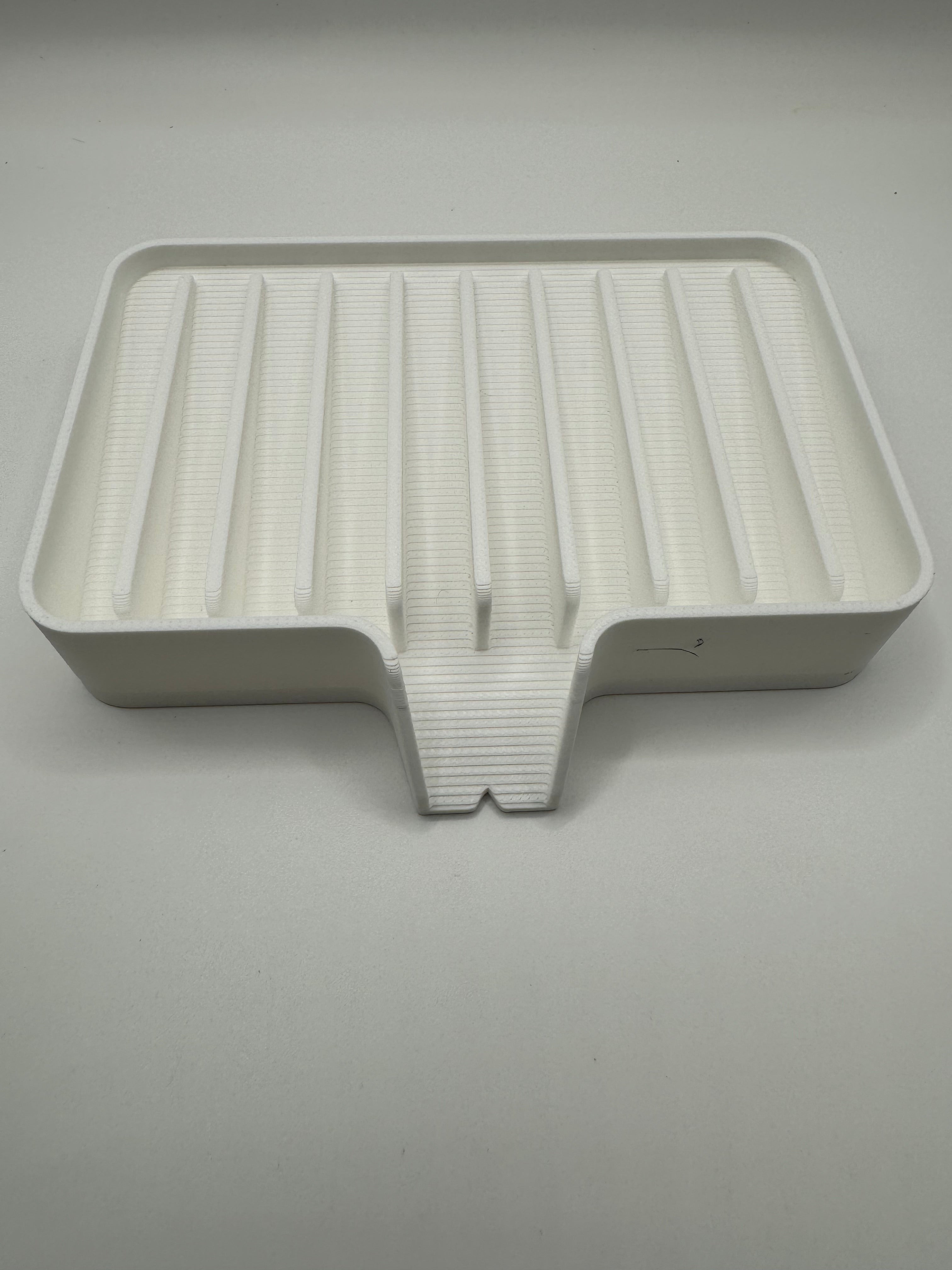 white soap tray with water drain